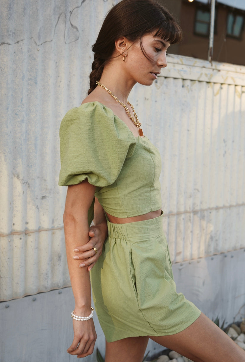 Kiwi green cropped top with a tie back and puff sleeves with matching shorts for women