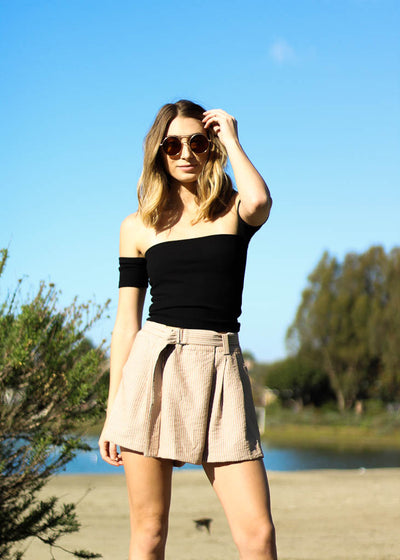 Taupe paperbag shorts with white stripes, pockets and an attached belt