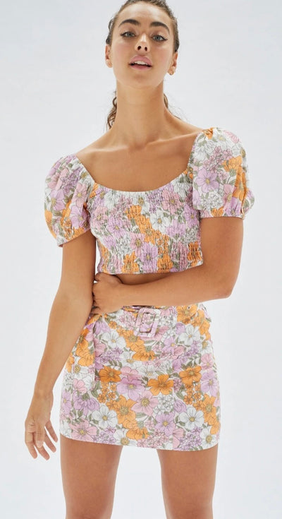 Floral puff sleeve top with an elastic torso by MINK PINK
