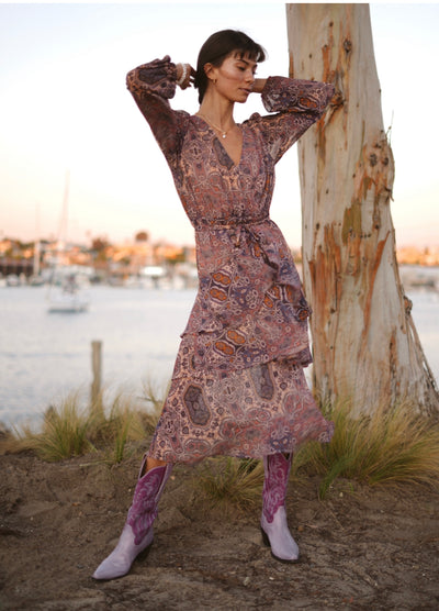 Long sleeve dress with a tie waist in a purple paisley print by MINK PINK